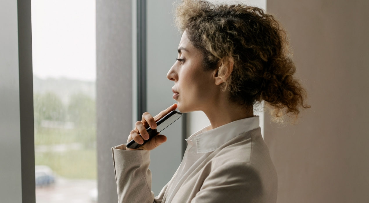 Woman staring out the window thinking