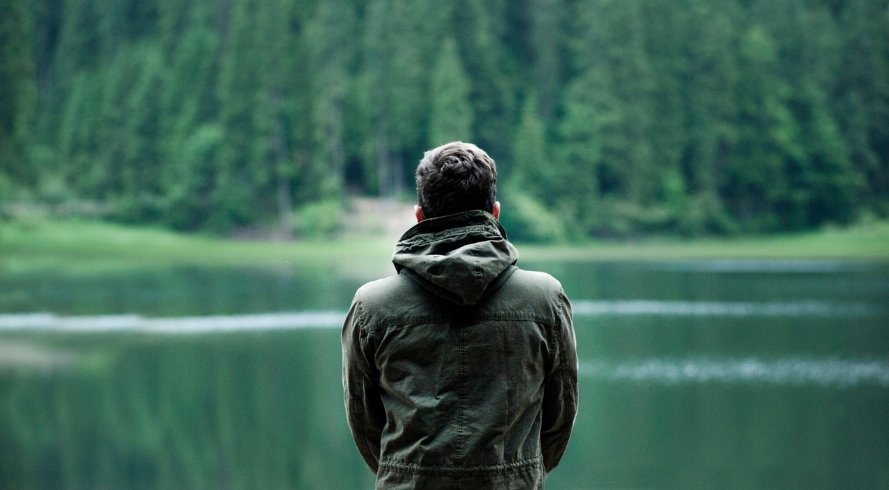 Man staring at the lake