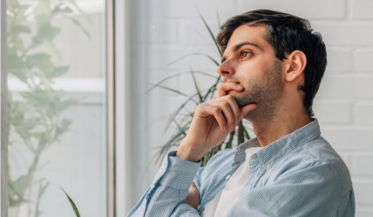 Man looking out the window